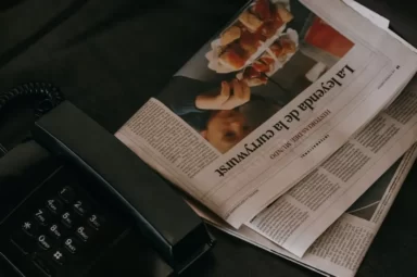 phone and newspaper